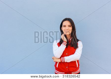 Portrait Of A Happy Woman Wearing College Style Jacket