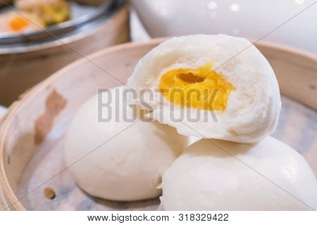 Delicious Dim Sum, Famous Cantonese Food In Asia, Fresh And Hot Salted Creamy Custard Buns In Bamboo