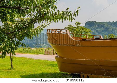 Aft Section Of A Large Wooden Ship On Display In Public Park.