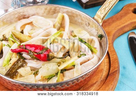 Mediterranean Noodle Soup With Colmar Rings, Onions, Cucumbers And Hot Peppers