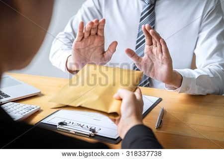 Anti Bribery And Corruption Concept, Business Man Refusing And Don't Receive Money Banknote In Envel