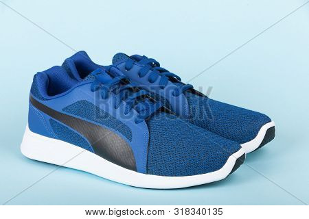Varna , Bulgaria - April 24, 2019: Puma St Trainer Evo Knit Sport Shoes On Blue Background. Puma Is 