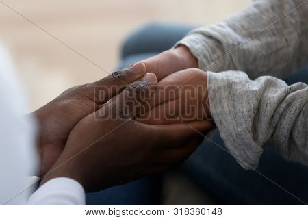 Mixed Ethnicity Family Couple Holding Hands Express Support In Marriage