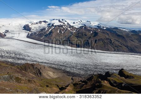 Skaftafellsjokull Glacial River Going Down The Volcano Mountain. Southern Iceland. Panoramic View Fr