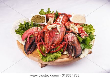 Mediterranean Cuisine, Lobster Stuffed With Cabbage, Greens And Sauces