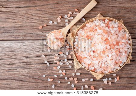Himalayan Pink Salt Crystals On Wooden Board, Scrub Spa Therapy Healthy. Top View With Copy Space.