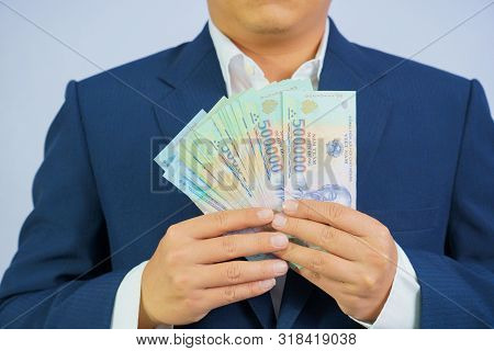 Money In Vietnam Hold On Hand Business Man Wearing A Blue Suit (socialist Republic Of Vietnam), Dong