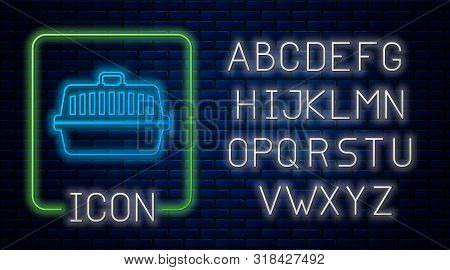 Glowing Neon Pet Carry Case Icon Isolated On Brick Wall Background. Carrier For Animals, Dog And Cat