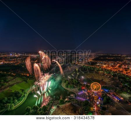 Fireworks Captured From A High Perspektiv With A Big City Wide View Over Munich.