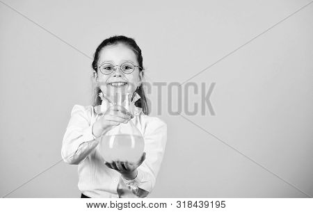 Small Smart Girl With Testing Flask. Education And Knowledge. Child Study Bilogy Lesson. Science Res