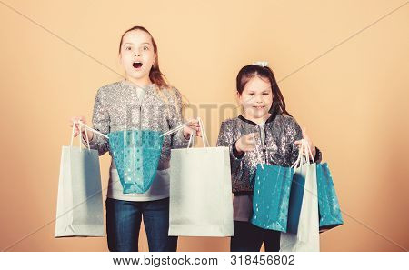 Girls Sisters Friends With Shopping Bags Beige Background. Shopping And Purchase. Black Friday. Sale