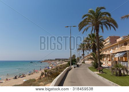 Mil Palmeras Costa Blanca Spain With Palm Trees And Apartments And Beach In Beautiful Summer Sunshin