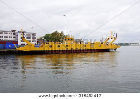 Karlskrona, Sweden -july 23, 2019: Yellow Ferry Ship Aspö Docked In The Harbor Of Karlskrona.