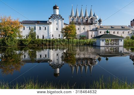 The Bell Tower Of The Tikhvin Assumption (bogorodichny Uspensky)   Monastery With A Reflection In Th
