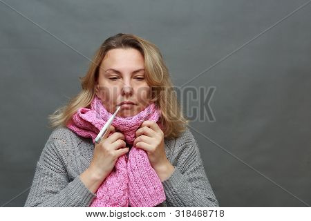 Sick Woman With Seasonal Flu Measuring Body Temperature With Thermometer In Her Mouth Reaching 38 De
