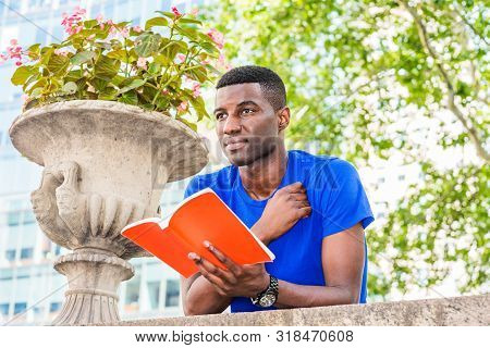 Way To Success. Young African American College Student Studying In New York, Wearing Blue Short Slee