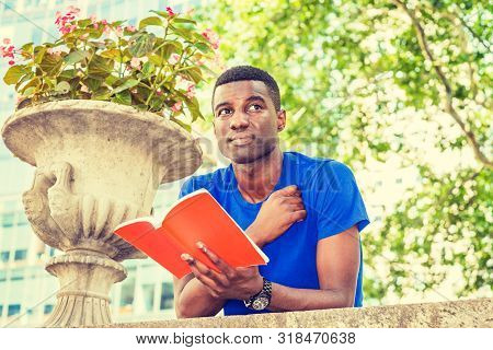 Way To Success. Young African American College Student Studying In New York, Wearing Blue Short Slee