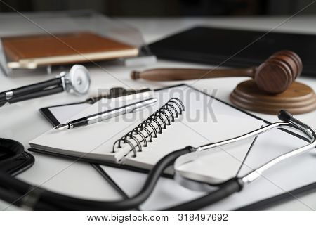Medical Law Concept.  Gavel And Stethoscope On The Wihte Table.