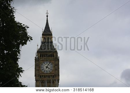Top Portion Of The Big Ben Clock Tower In The City Of London, England