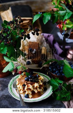 Norwegian Waffles With Brunost Cheese And Blueberries.style Rustic.selective Focus