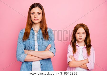 Portrait Of Concetrated Friends Crossing Their Hands Looking Isolated Over Pink Background