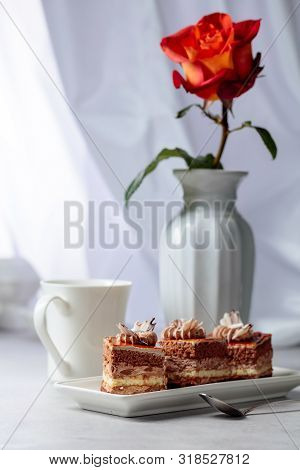 Layered Cakes With Rose On A White Marmorean Table. Romantic Breakfast.