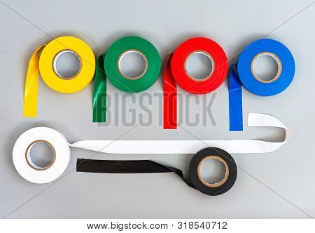 Rubber Insulating Tape Of Different Colors On A Gray Background