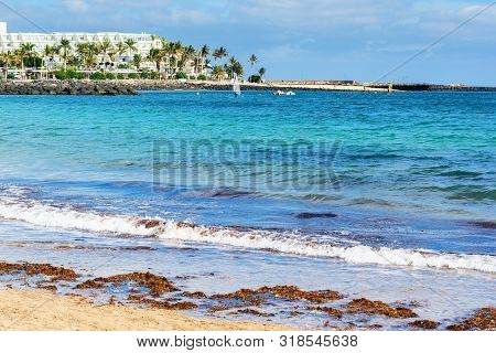 View Of Playa De Las Cucharas Beach In Costa Teguise, Lanzarote, Spain, Turquoise Waters, Selective 