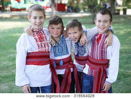 Ukraine, Pokrov - August 23, 2019: National Flag Day Celebration. Four Young Boys Friends Dressed In