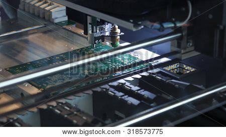 Close-up Of Printed Circuit Board Which Is Created By Special Automatic Machine In A Workshop. Elect