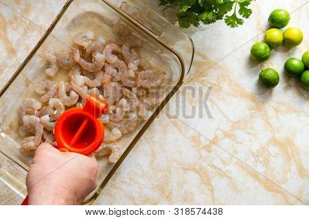 Squeezing Lime Juice Over Shrimp