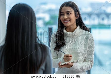 Asian Woman Professional Psychologist Doctor Giving The Consult To Female Patients In Modern Living 