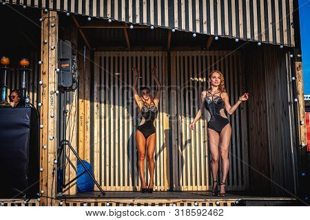 Moscow, Russia - July 27, 2019: Go Go Dance Outdoor. Two Sexy Woman At Johncalliano Hookah Fest.