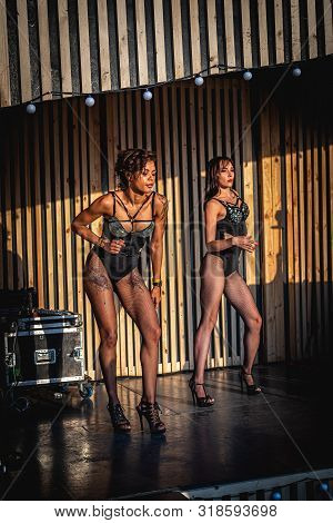 Moscow, Russia - July 27, 2019: Go Go Dance Outdoor. Two Sexy Woman At Johncalliano Hookah Fest.