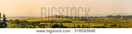 Panorama Landscape, Wind Turbines On The Field In Rural Area. Ecology Concept