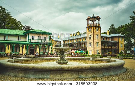 Iwonicz Zdroj, Poland - 13.08.2019: Old Town In Poland Iwonicz Zdroj. View At Town Square, Fountain 