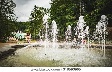 Iwonicz Zdroj, Poland - 13.08.2019: Old Town In Poland Iwonicz Zdroj. View At Fountain In Gardens. T