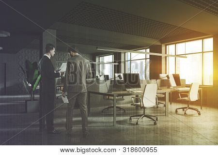 Two Businessmen In Gray Office