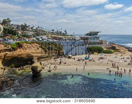 Beachgoers Enjoying A Beautiful Sunny Afternoon At La Jolla Cove In San Diego, Ca. Usa. Famous Touri