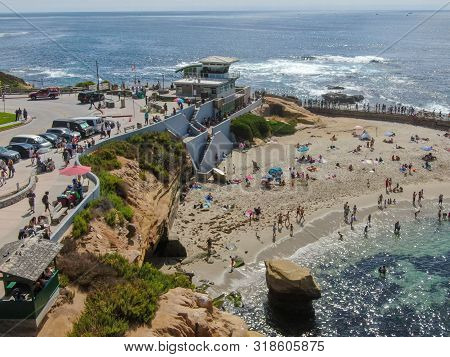 Beachgoers Enjoying A Beautiful Sunny Afternoon At La Jolla Cove In San Diego, Ca. Usa. Famous Touri