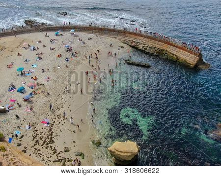 Beachgoers Enjoying A Beautiful Sunny Afternoon At La Jolla Cove In San Diego, Ca. Usa. Famous Touri