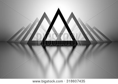 Abstract Futuristic Geometric Background With Repeating Black Large Triangles Over Mirror Reflective