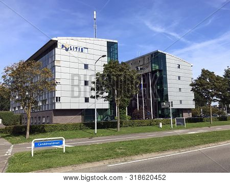 Almere Stad, The Netherlands - August 24, 2019: Police Station Almere Baljuwstraat Against A Partly 