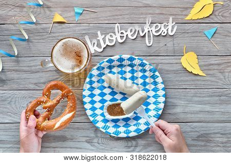 Oktoberfest, Traditional Festival Food: White Sausages, Pretzel And Beer. Flat Lay On Rustic Wooden 