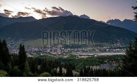Night View On Mestia With Its Beautiful Illuminated Svan Towers And High Mountains. Svaneti, Georgia