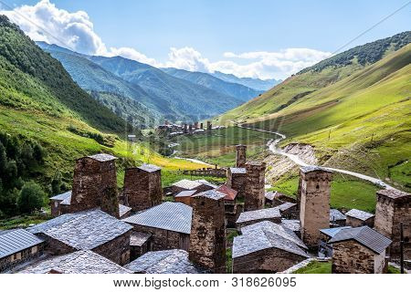 View Of The Ushguli Village At The Foot Of Mt. Shkhara. Picturesque And Gorgeous Scene. Rock Towers