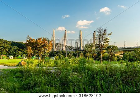 Aramchangyo Bridge Designed By Sk E&c Near Sejong City In South Korea Under Blue Partly Cloudy Sky.