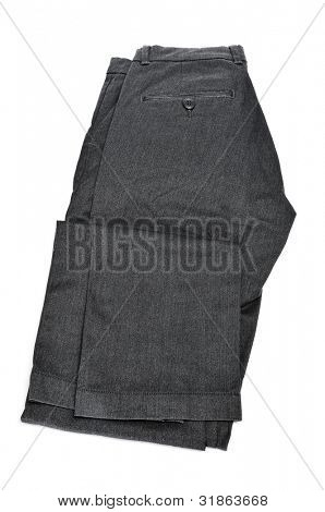 pantalones gris dobladas sobre un fondo blanco