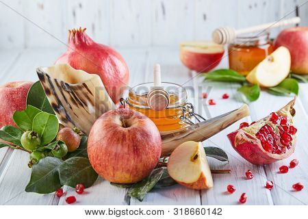 Rosh Hashanah - Jewish New Year Holiday Concept. Traditional Symbols: Honey Jar And Fresh Apples Wit