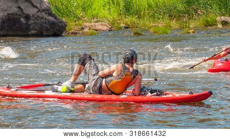 Myhiya, Ukraine - August 17, 2019: Athletes Kayakers During Training On Whitewater. Man On Inflatabl